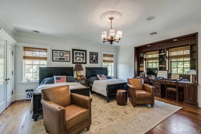 a bathroom with a granite countertop sink mirror and toilet