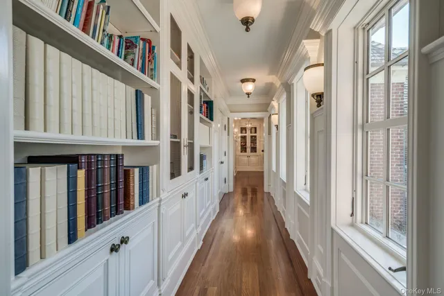 a spacious bedroom with two beds and wooden floor