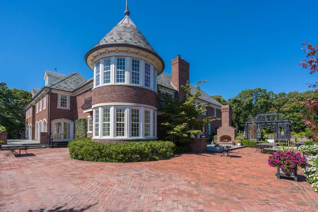 a view of a table and chairs in a garden