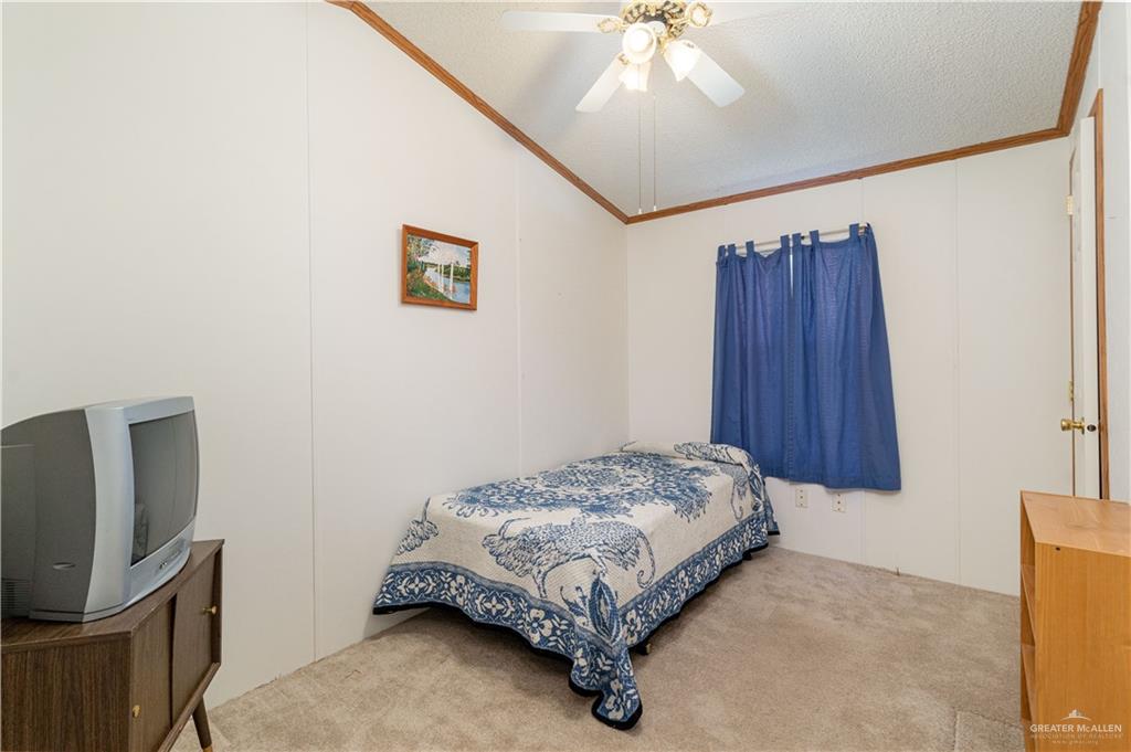 2004 Vernon Avenue Mission, TX 78572 - Photo 11 of 20 a bedroom with a bed and a flat screen tv