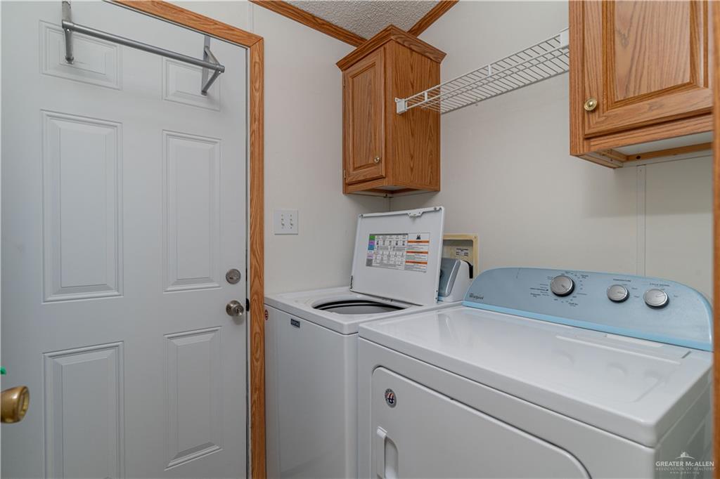 2004 Vernon Avenue Mission, TX 78572 - Photo 15 of 20 a utility room with dryer and washer