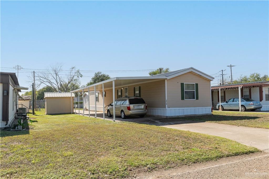 2004 Vernon Avenue Mission, TX 78572 - Photo 2 of 20 a front view of a house with a yard and seating space