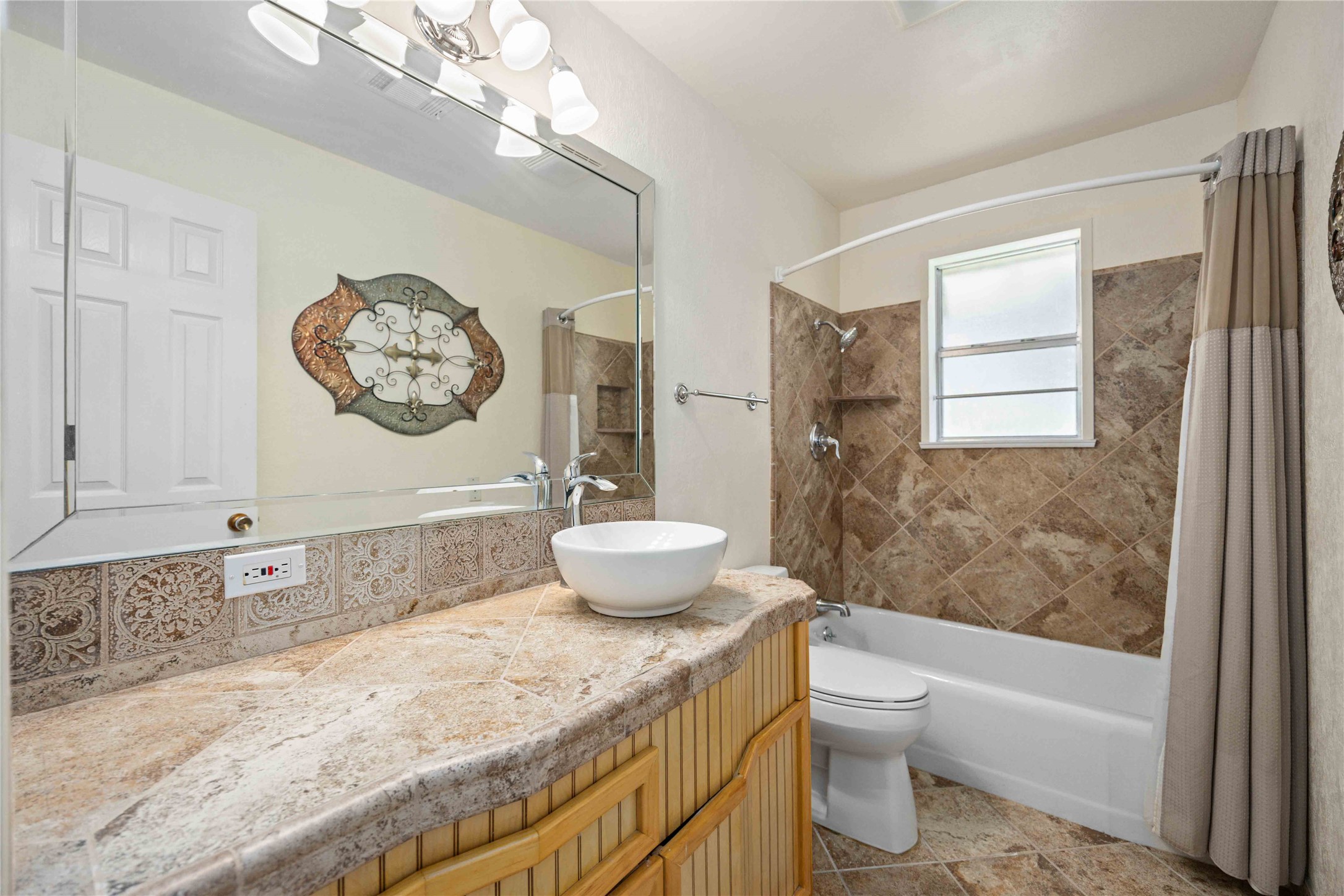 3910 Brookston Street Houston, TX 77045 - Photo 18 of 29 a bathroom with a granite countertop sink a toilet and a bathtub