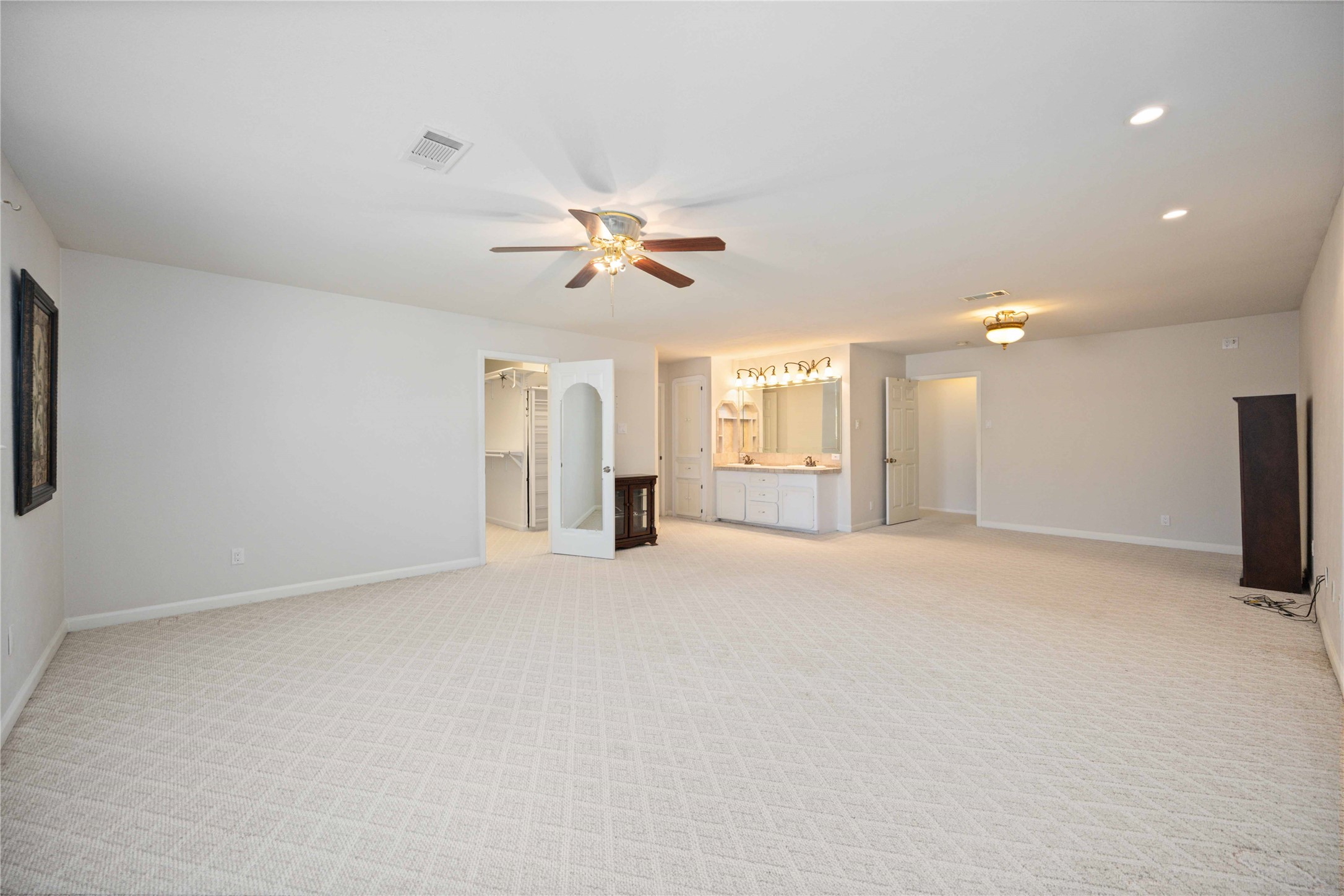 3910 Brookston Street Houston, TX 77045 - Photo 20 of 29 an empty room with chandelier fan and windows