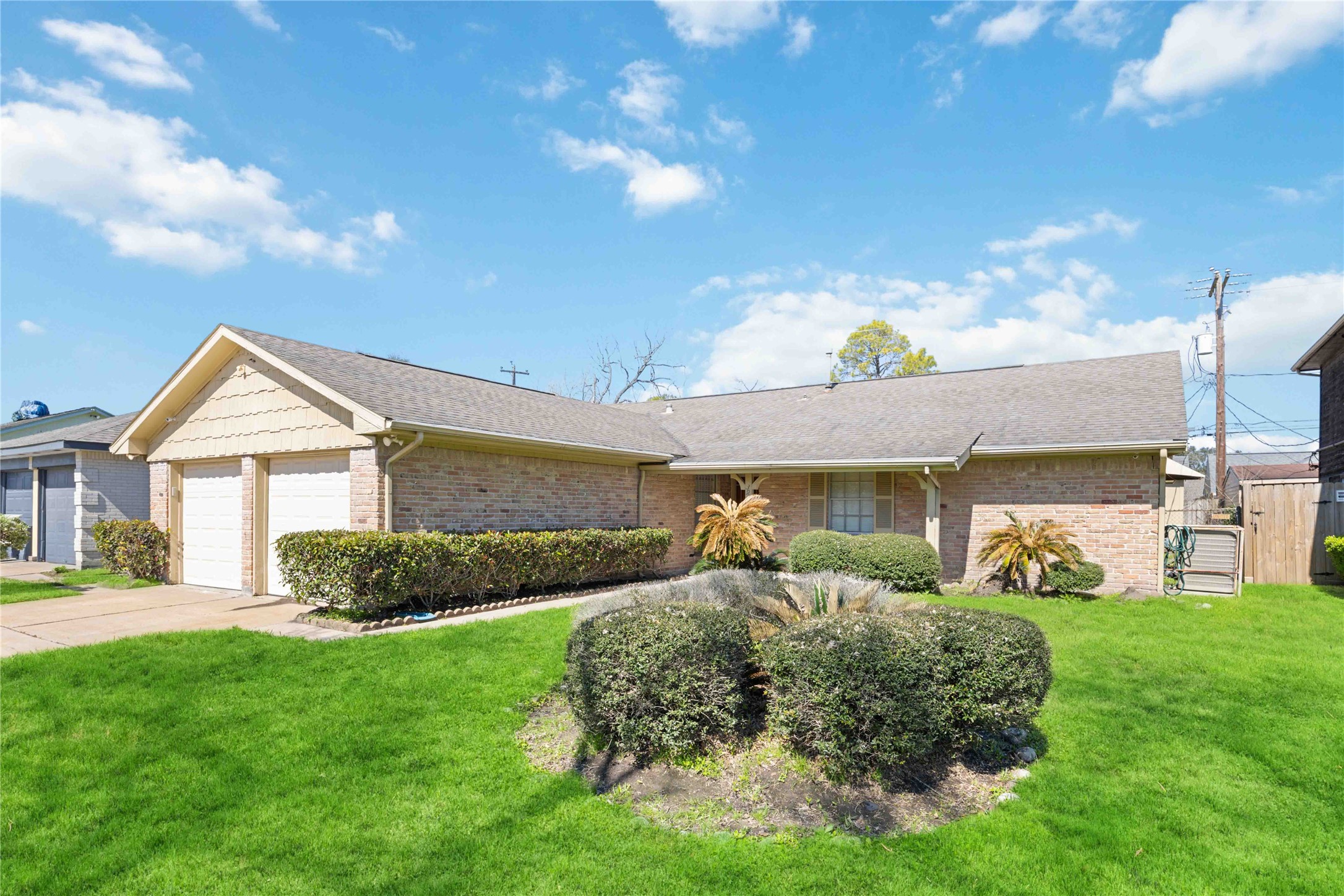 3910 Brookston Street Houston, TX 77045 - Photo 2 of 29 a front view of a house with a yard and garage