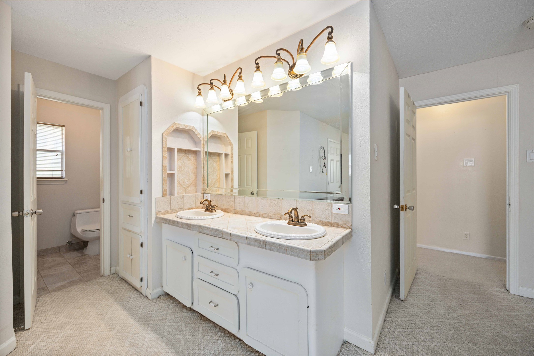 3910 Brookston Street Houston, TX 77045 - Photo 22 of 29 a spacious bathroom with a double vanity sink mirror and toilet