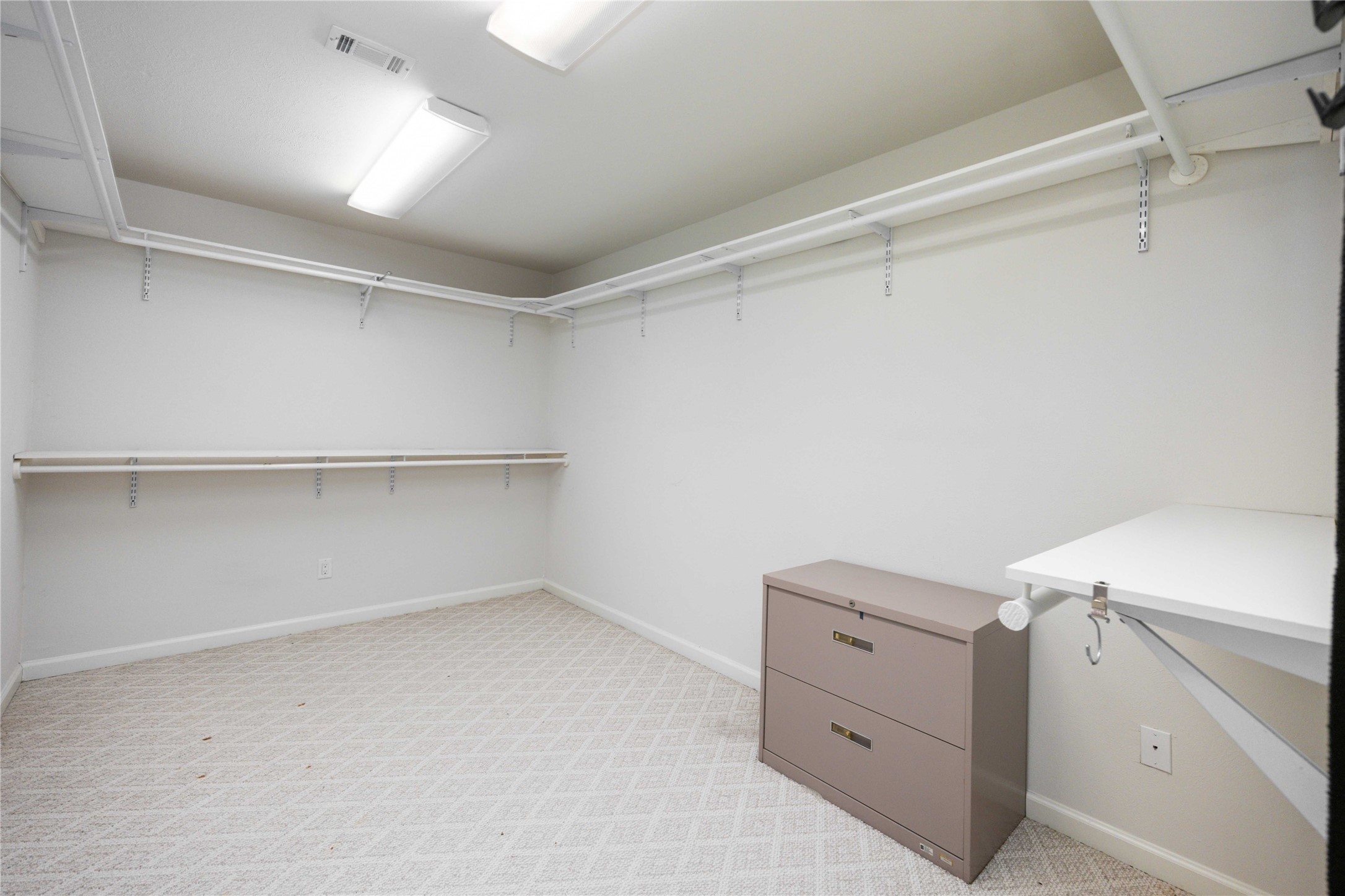 3910 Brookston Street Houston, TX 77045 - Photo 25 of 29 a room with a cabinets and dryer
