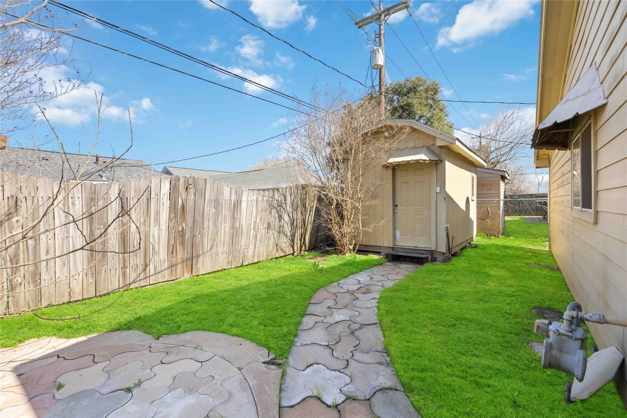 3910 Brookston Street Houston, TX 77045 - Photo 29 of 29 a view of a house with a yard