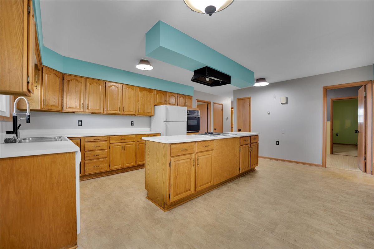 2360 Gurler Road Malta, IL 60150 - Photo 8 of 40 a kitchen with sink cabinets and window