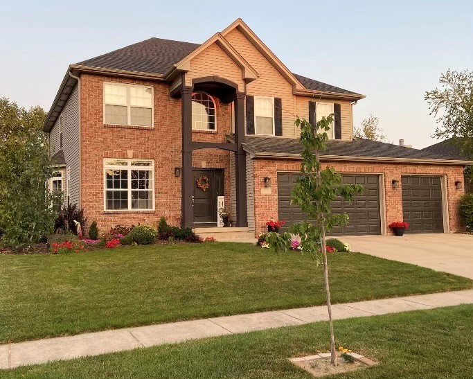 1785 Briggs Street Sycamore, IL 60178 - Photo 1 of 43 a front view of a house with a yard