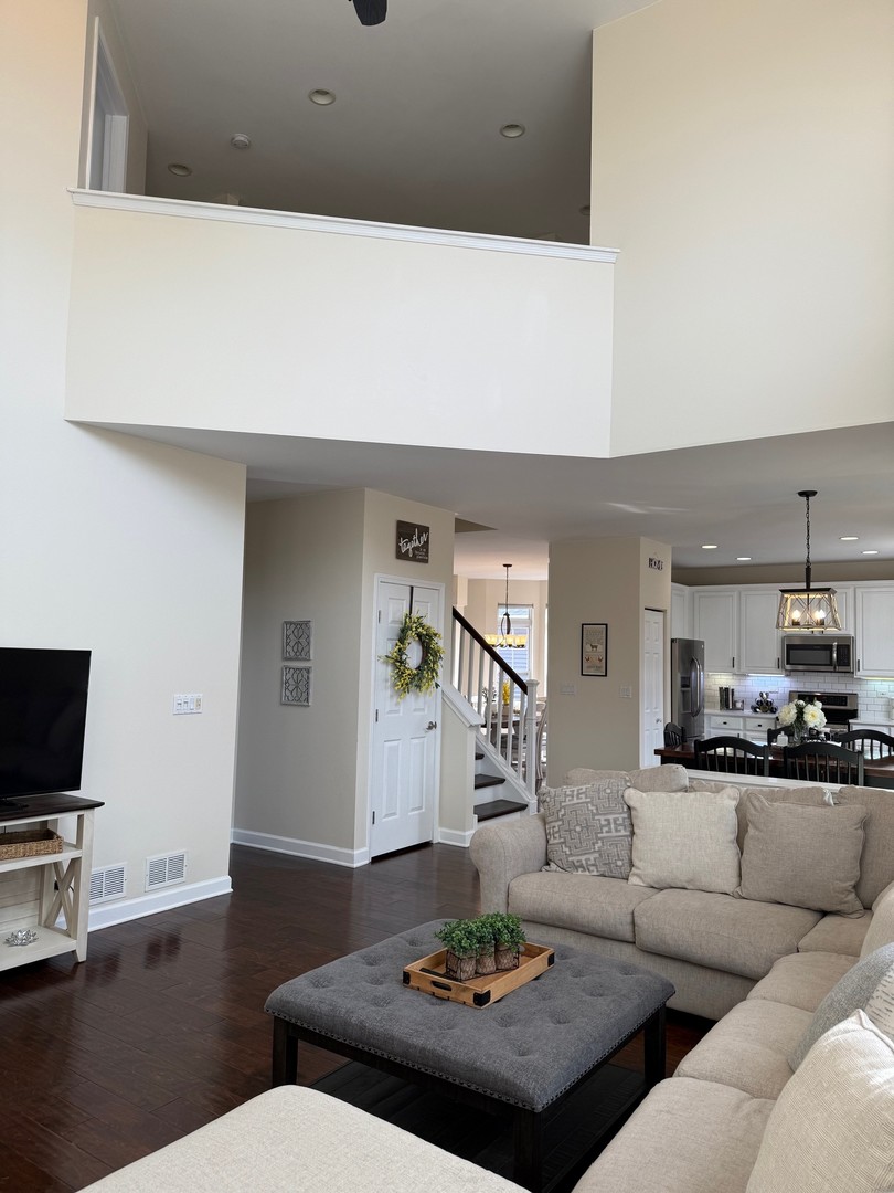1785 Briggs Street Sycamore, IL 60178 - Photo 15 of 43 a living room with furniture and a flat screen tv
