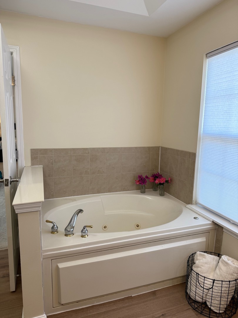 1785 Briggs Street Sycamore, IL 60178 - Photo 22 of 43 a bathroom with a bathtub and sink
