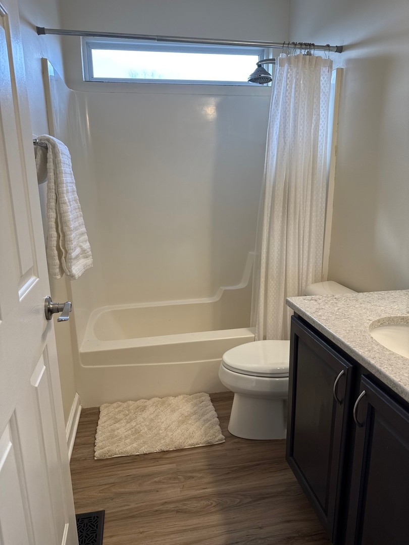 1785 Briggs Street Sycamore, IL 60178 - Photo 25 of 43 a bathroom with a sink a toilet and shower