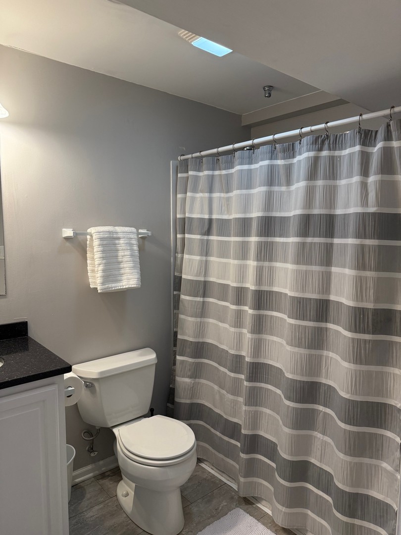 1785 Briggs Street Sycamore, IL 60178 - Photo 33 of 43 a bathroom with a toilet and a shower