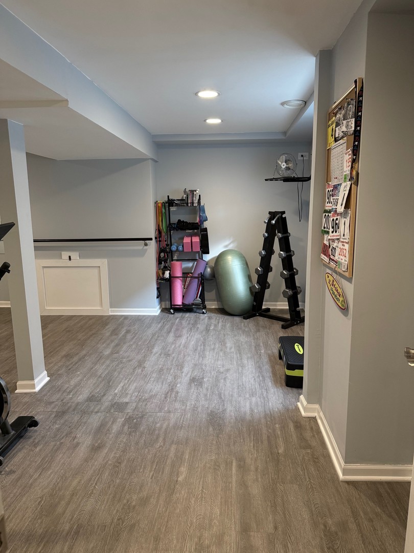 1785 Briggs Street Sycamore, IL 60178 - Photo 37 of 43 a view of a room with gym equipment and wooden floor