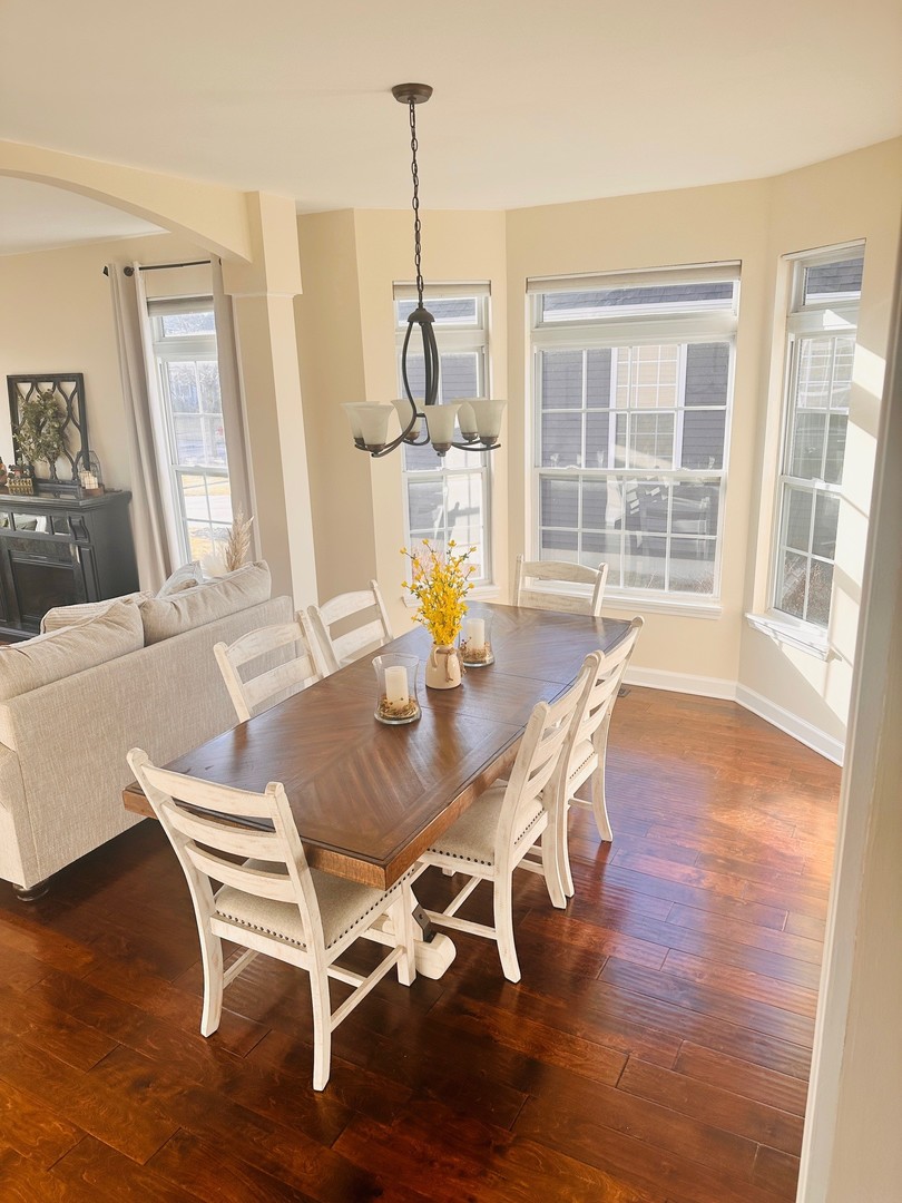 1785 Briggs Street Sycamore, IL 60178 - Photo 9 of 43 a view of a dining room with furniture window and wooden floor