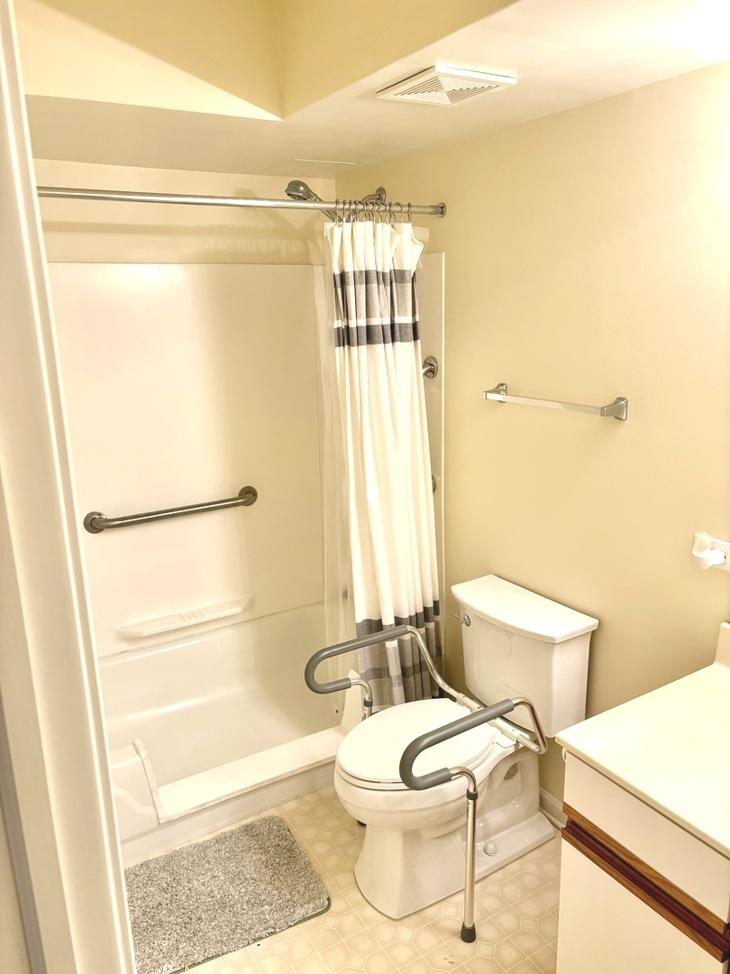 1220 Depot Street, Unit 305 Glenview, IL 60025 - Photo 16 of 28 a bathroom with a toilet a sink and a shower