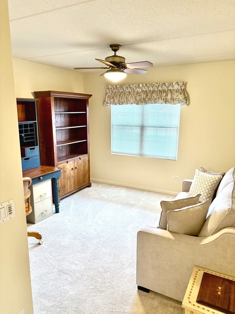 1220 Depot Street, Unit 305 Glenview, IL 60025 - Photo 18 of 28 a living room with furniture and a window