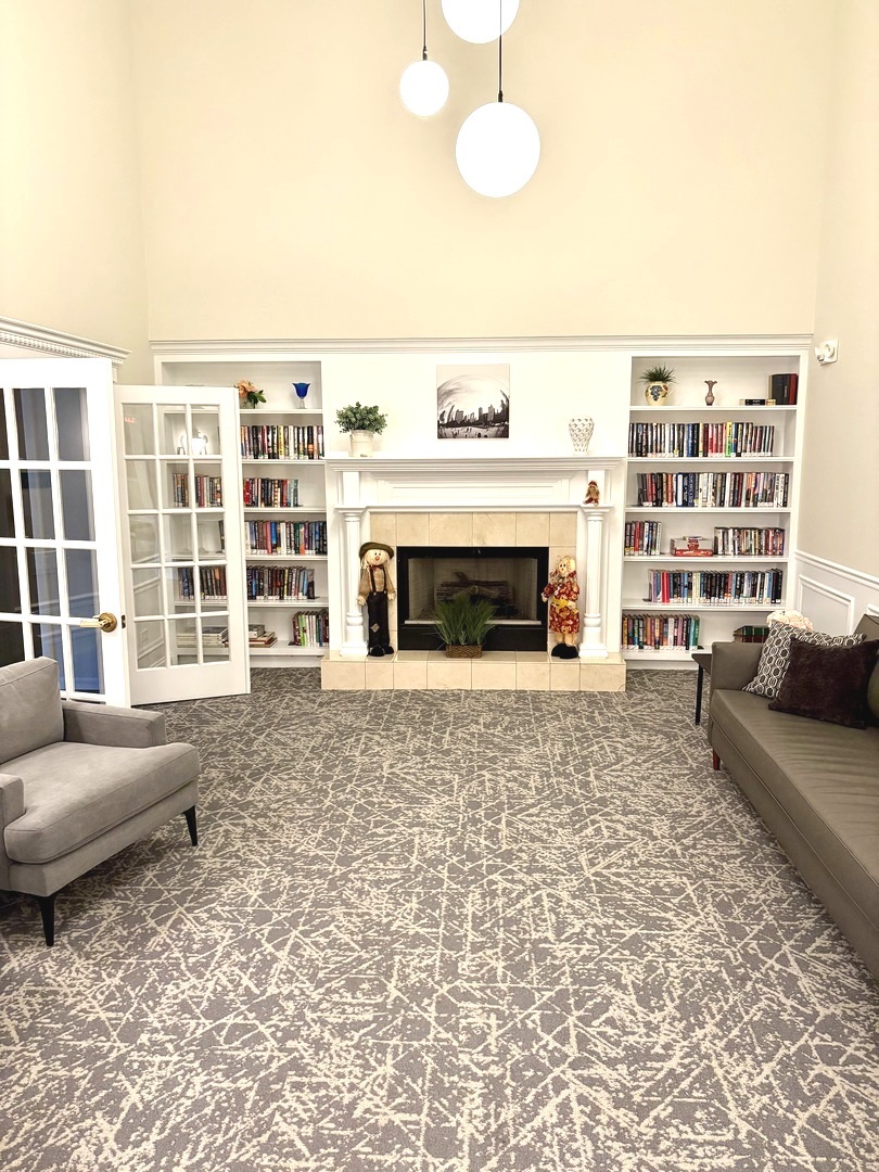 1220 Depot Street, Unit 305 Glenview, IL 60025 - Photo 21 of 28 a living room with furniture window and fireplace