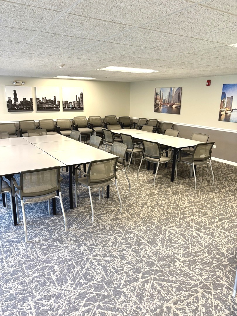 1220 Depot Street, Unit 305 Glenview, IL 60025 - Photo 24 of 28 a large dining space with furniture a rug and a view of kitchen