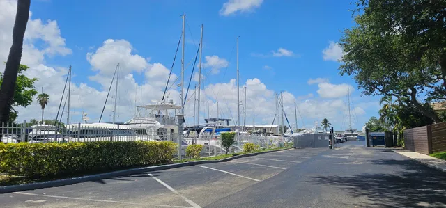 a sign board with a play ground in the back