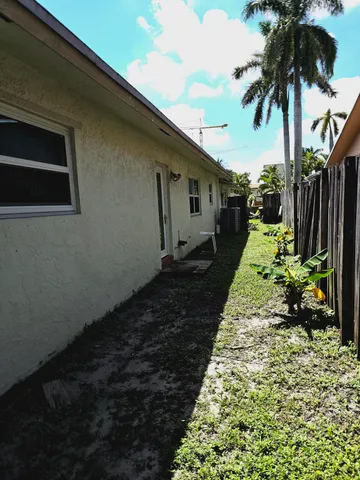 a kitchen with a stove a sink and a refrigerator