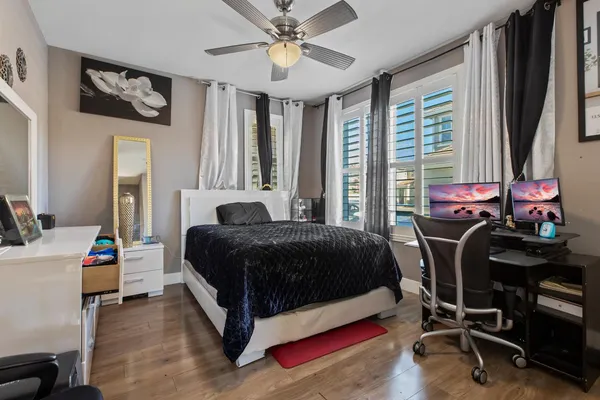 a bedroom with a bed and a table