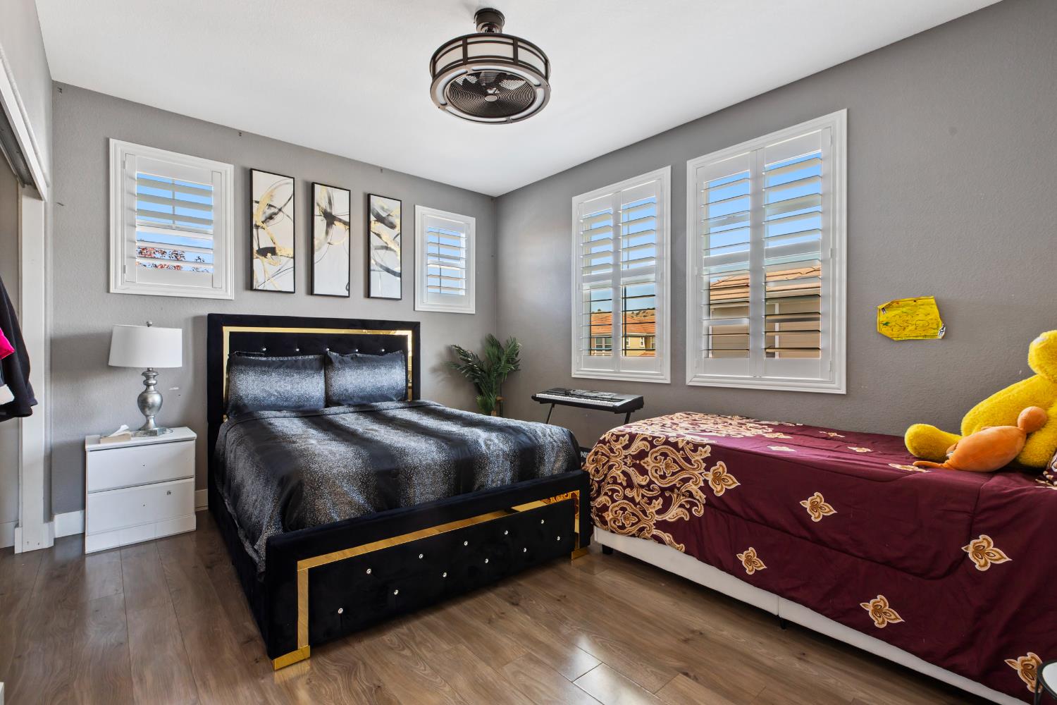 9423 Vintner Circle Patterson, CA 95363 - Photo 17 of 33 a bedroom with a bed and a window