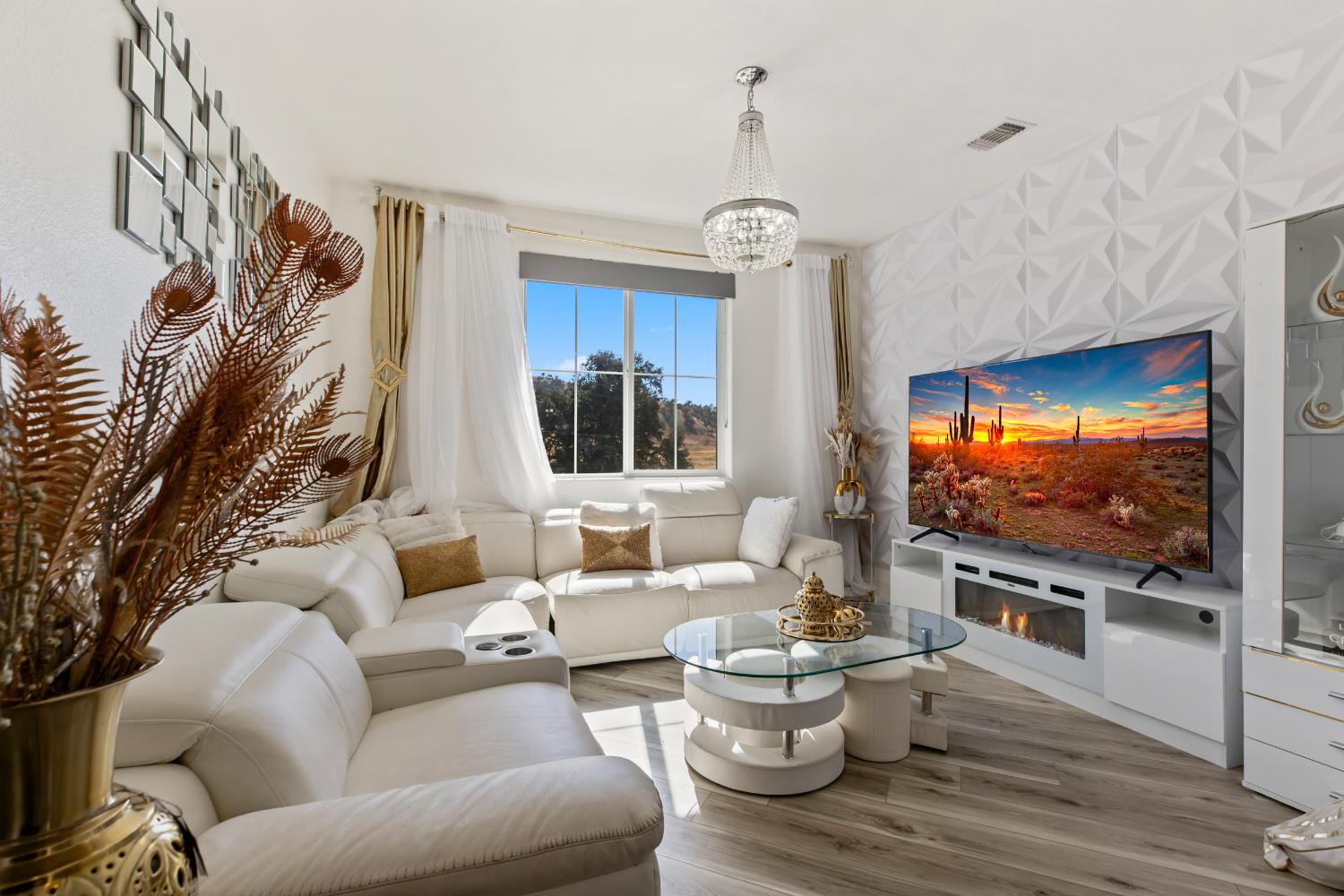 9423 Vintner Circle Patterson, CA 95363 - Photo 18 of 33 a living room with furniture a flat screen tv and kitchen view