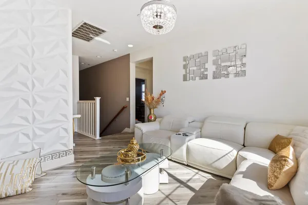 a living room with furniture and a rug
