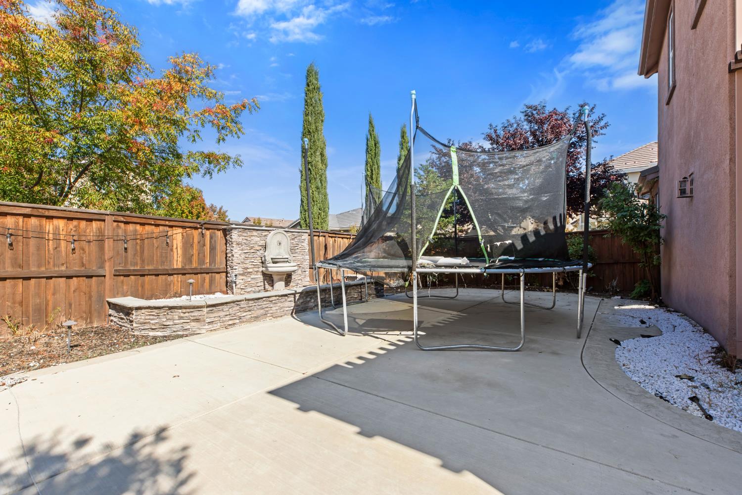 9423 Vintner Circle Patterson, CA 95363 - Photo 27 of 33 a view of a swimming pool with a lounge chair