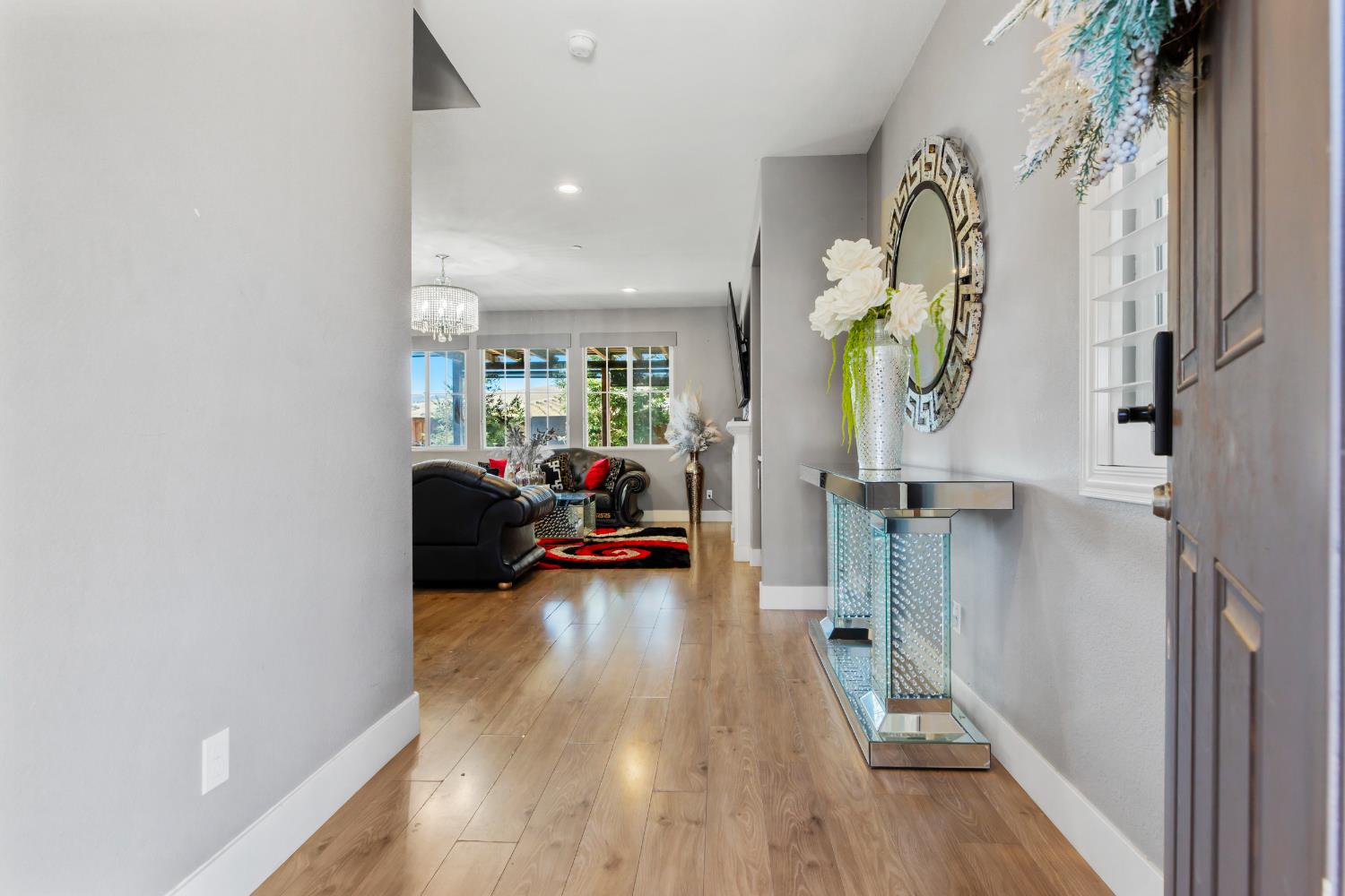 9423 Vintner Circle Patterson, CA 95363 - Photo 4 of 33 a living room with furniture and a wooden floor