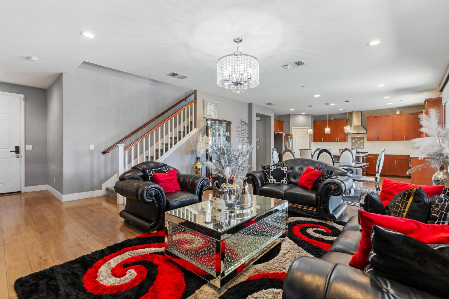 9423 Vintner Circle Patterson, CA 95363 - Photo 9 of 33 a living room with lots of furniture and a chandelier