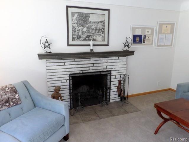 19226 Champaign Road Allen Park, MI 48101 - Photo 23 of 78 23. NATURAL FIREPLACE WITH BRICK ACCENTS + WOOD MANTLE WITH MARBLE TOP!