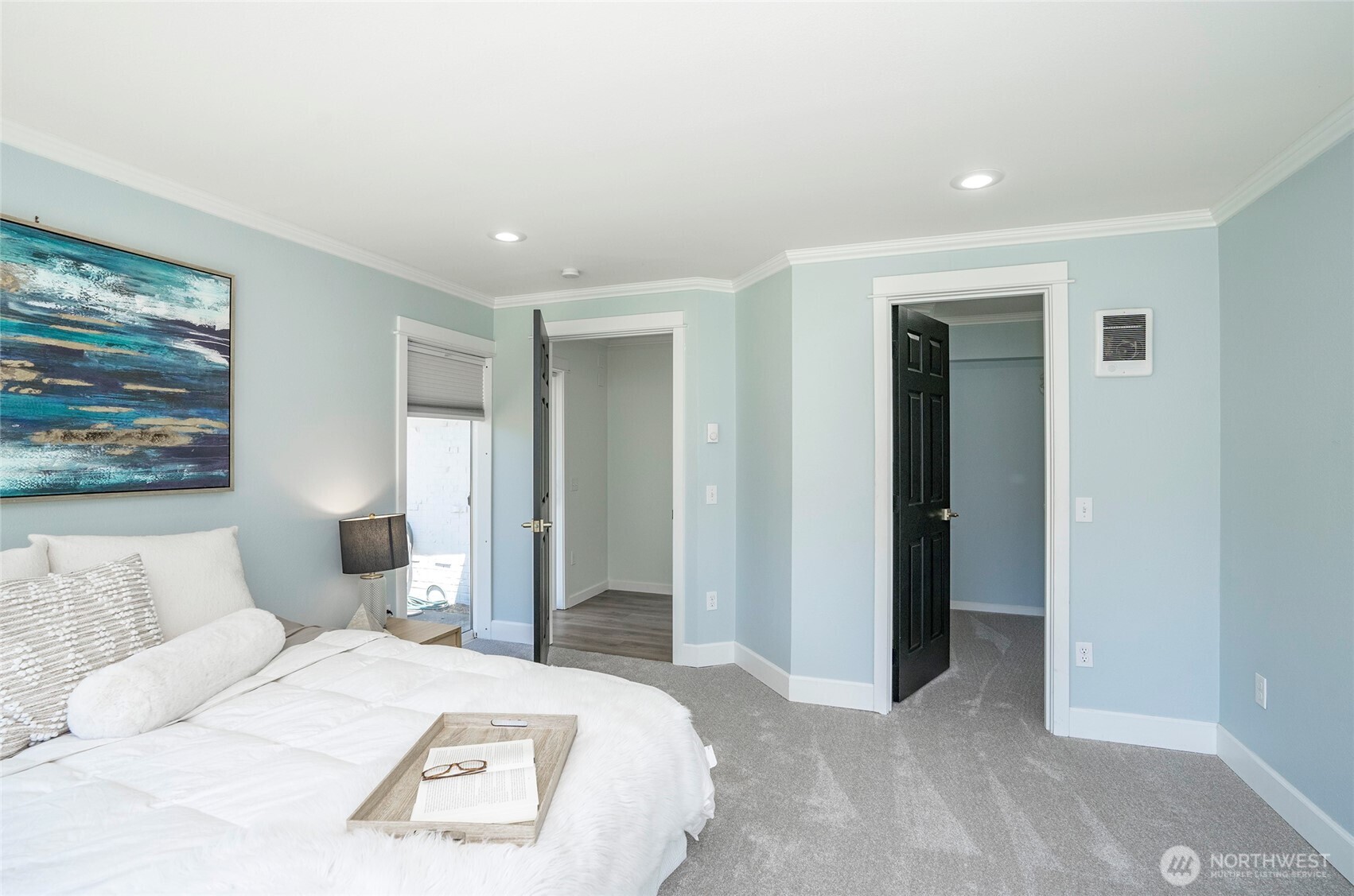 15512 Elm Street East Sumner, WA 98390 - Photo 16 of 37 a bedroom with a large bed and a couch