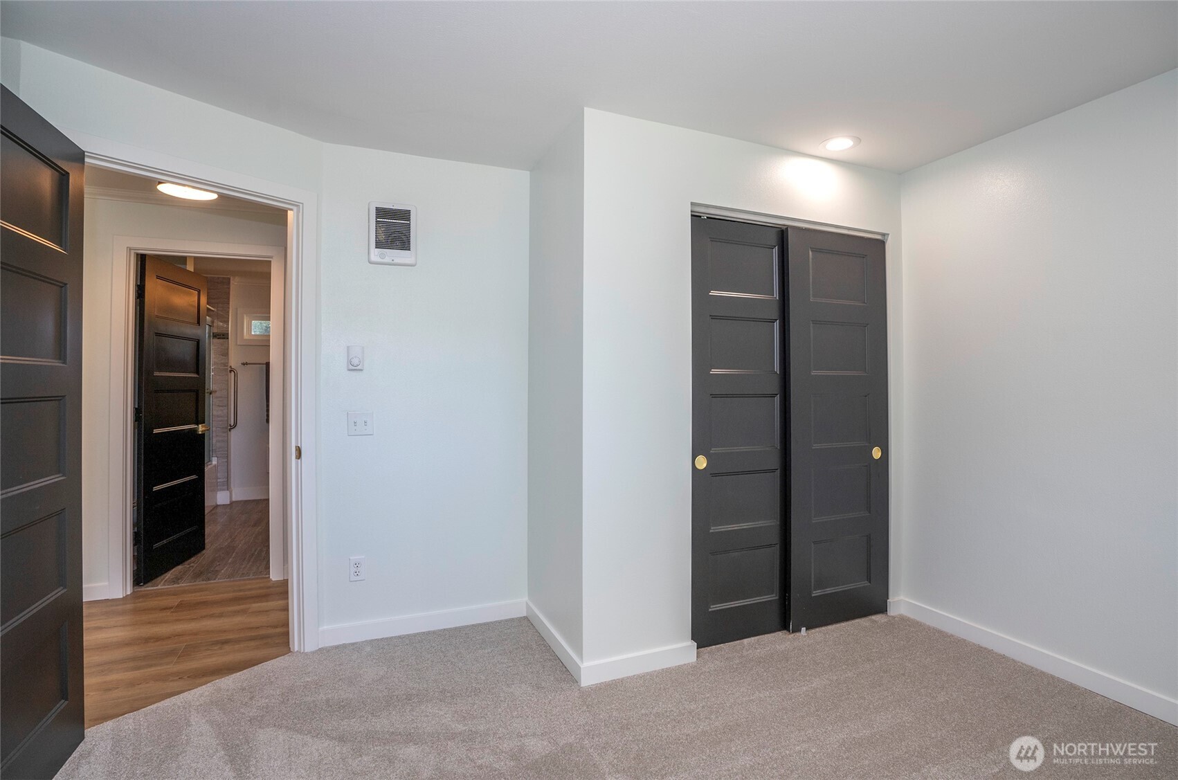 15512 Elm Street East Sumner, WA 98390 - Photo 18 of 37 an empty room with closet and wooden floor