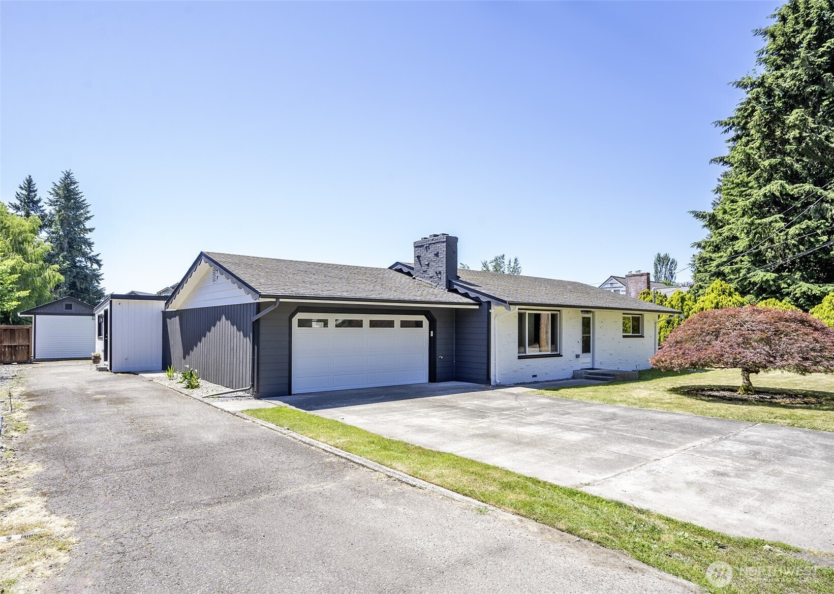 15512 Elm Street East Sumner, WA 98390 - Photo 2 of 37 a view of a house with a yard and large tree