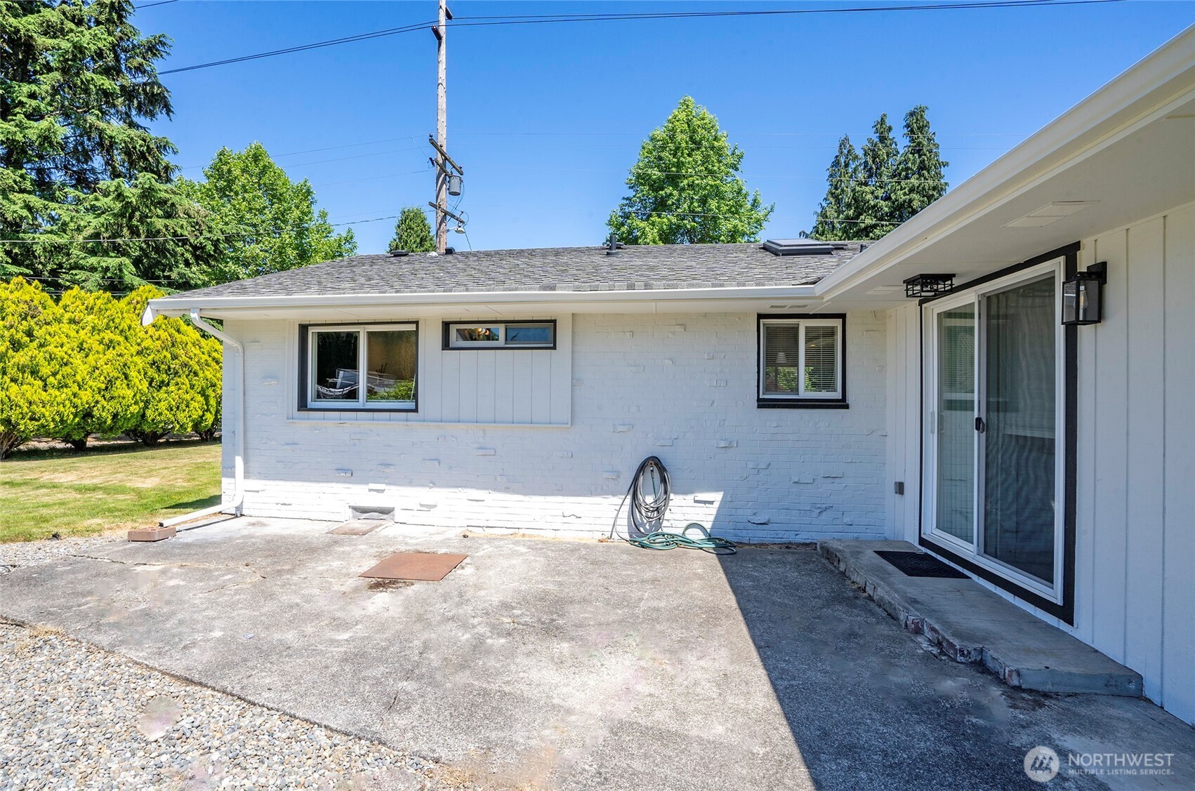 15512 Elm Street East Sumner, WA 98390 - Photo 22 of 37 a front view of a house with garden