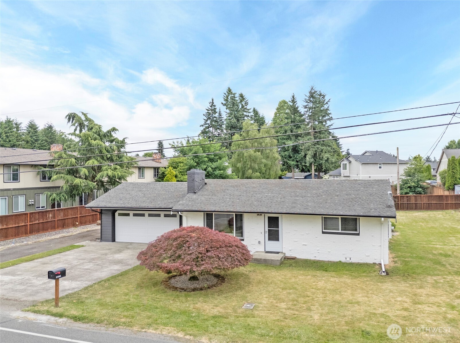 15512 Elm Street East Sumner, WA 98390 - Photo 3 of 37 a front view of a house with garden