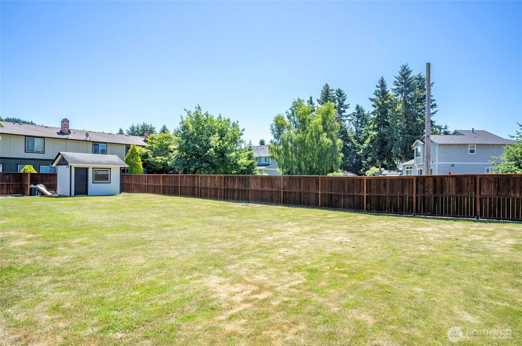 15512 Elm Street East Sumner, WA 98390 - Photo 34 of 37 a house with swimming pool in front of it