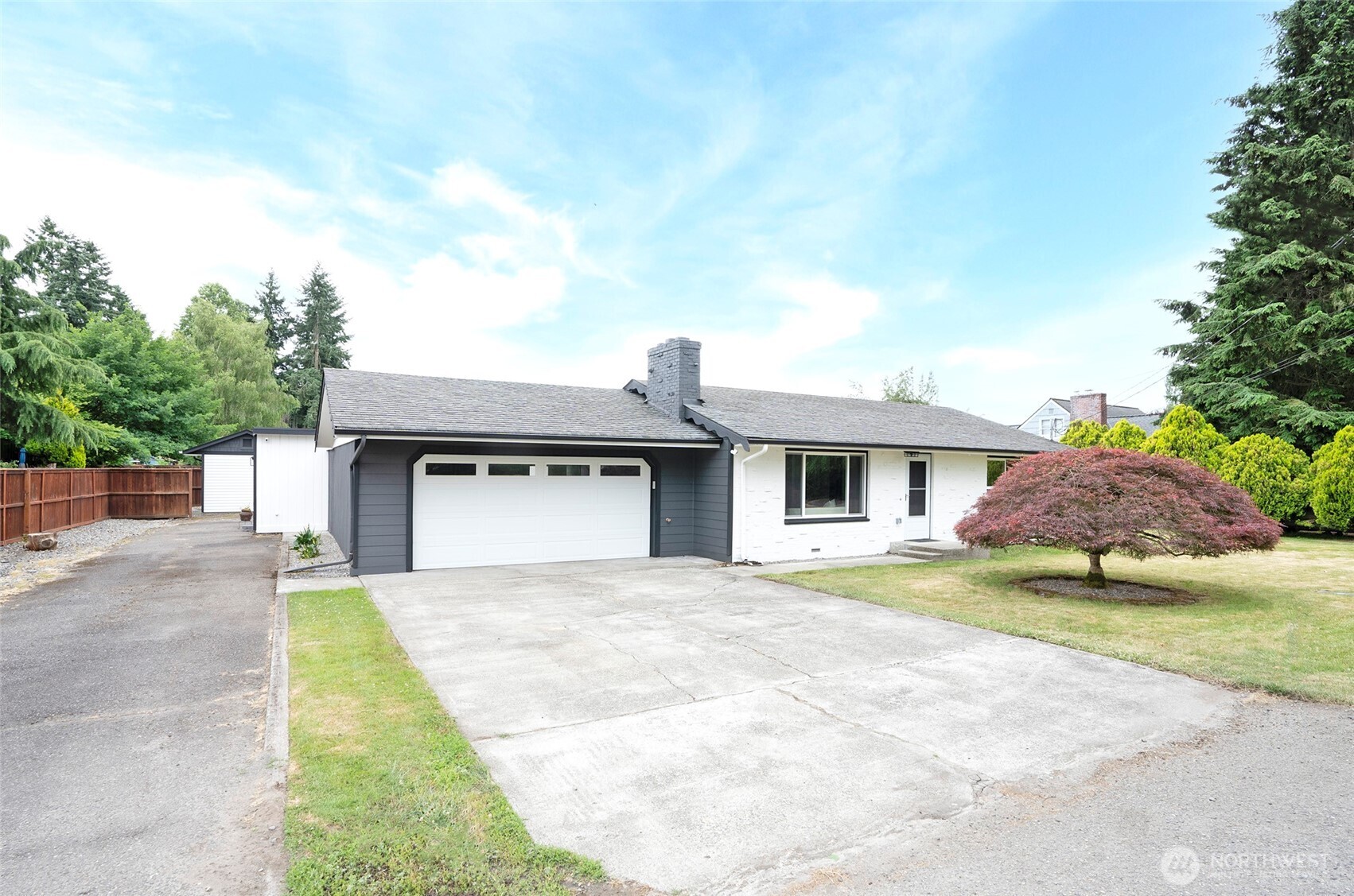 15512 Elm Street East Sumner, WA 98390 - Photo 35 of 37 a front view of a house with a yard and garage