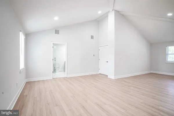 an empty room with wooden floor