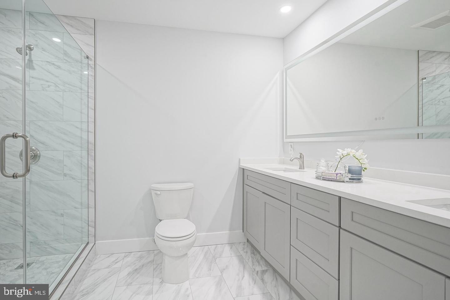 363 Atsion Road Shamong, NJ 08088 - Photo 21 of 30 a bathroom with a granite countertop sink a toilet and a shower