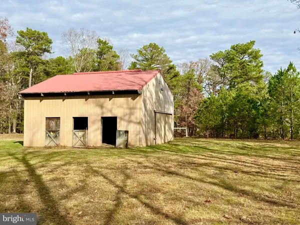 a house with trees in the background