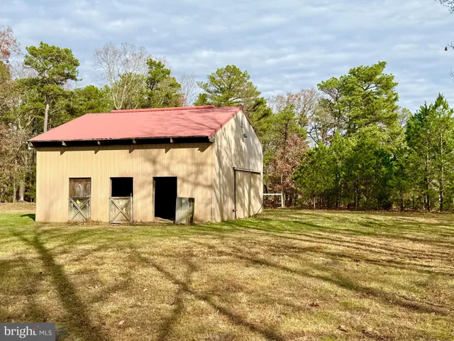 a house with trees in the background