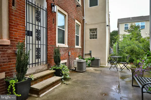 a building with potted plants in front of it