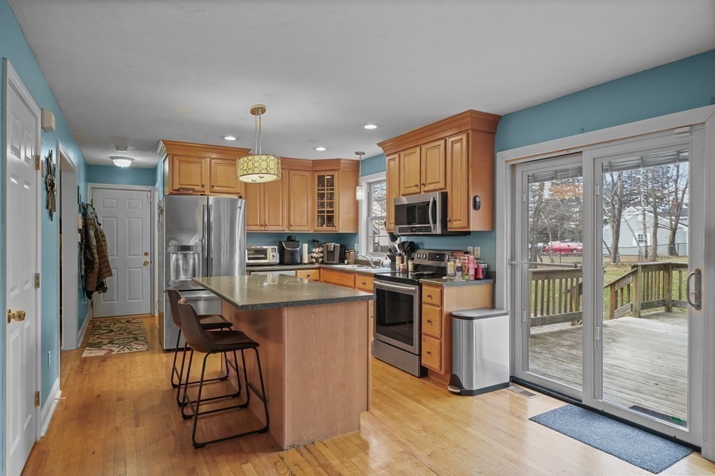 3 Carter Way Worcester, MA 01609 - Photo 12 of 32 a kitchen with stainless steel appliances granite countertop a refrigerator and a stove top oven