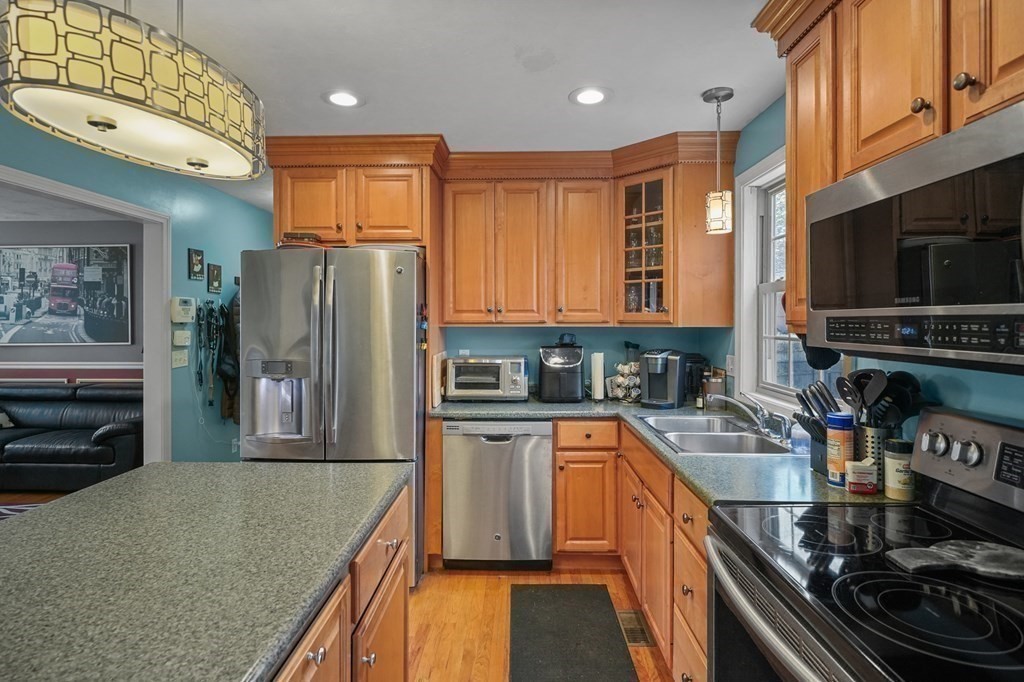 3 Carter Way Worcester, MA 01609 - Photo 14 of 32 a kitchen with stainless steel appliances granite countertop a refrigerator stove and sink