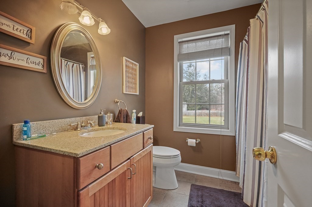 3 Carter Way Worcester, MA 01609 - Photo 18 of 32 a bathroom with a toilet sink and mirror