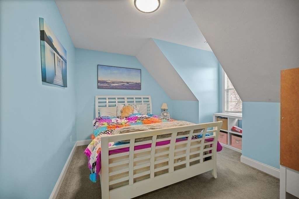 3 Carter Way Worcester, MA 01609 - Photo 20 of 32 a bedroom with a bed and a table